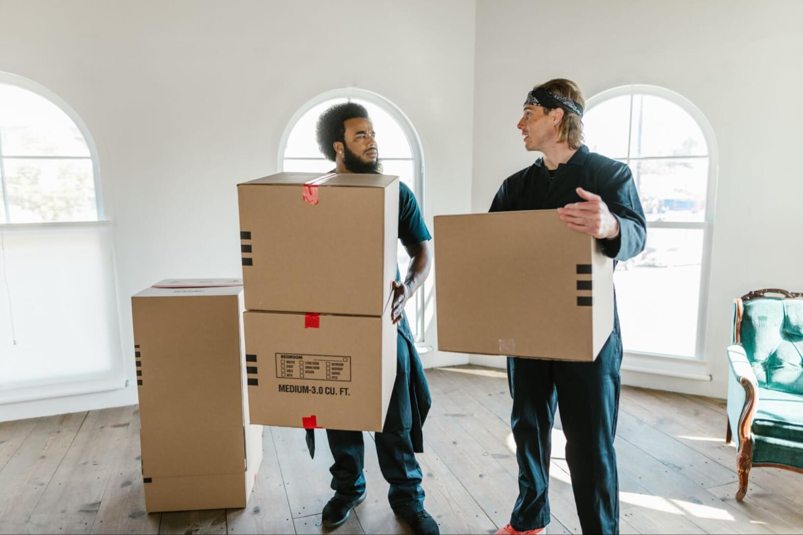 two-people-with-moving-out-boxes